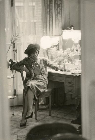 1960 - Coco Chanel laughing while being photographed by Shahrokh