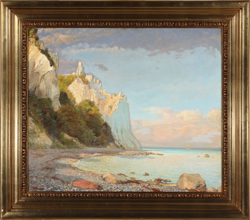 A serene coastal landscape featuring towering white cliffs, a rocky pebble beach, and calm turquoise waters under a soft sky.