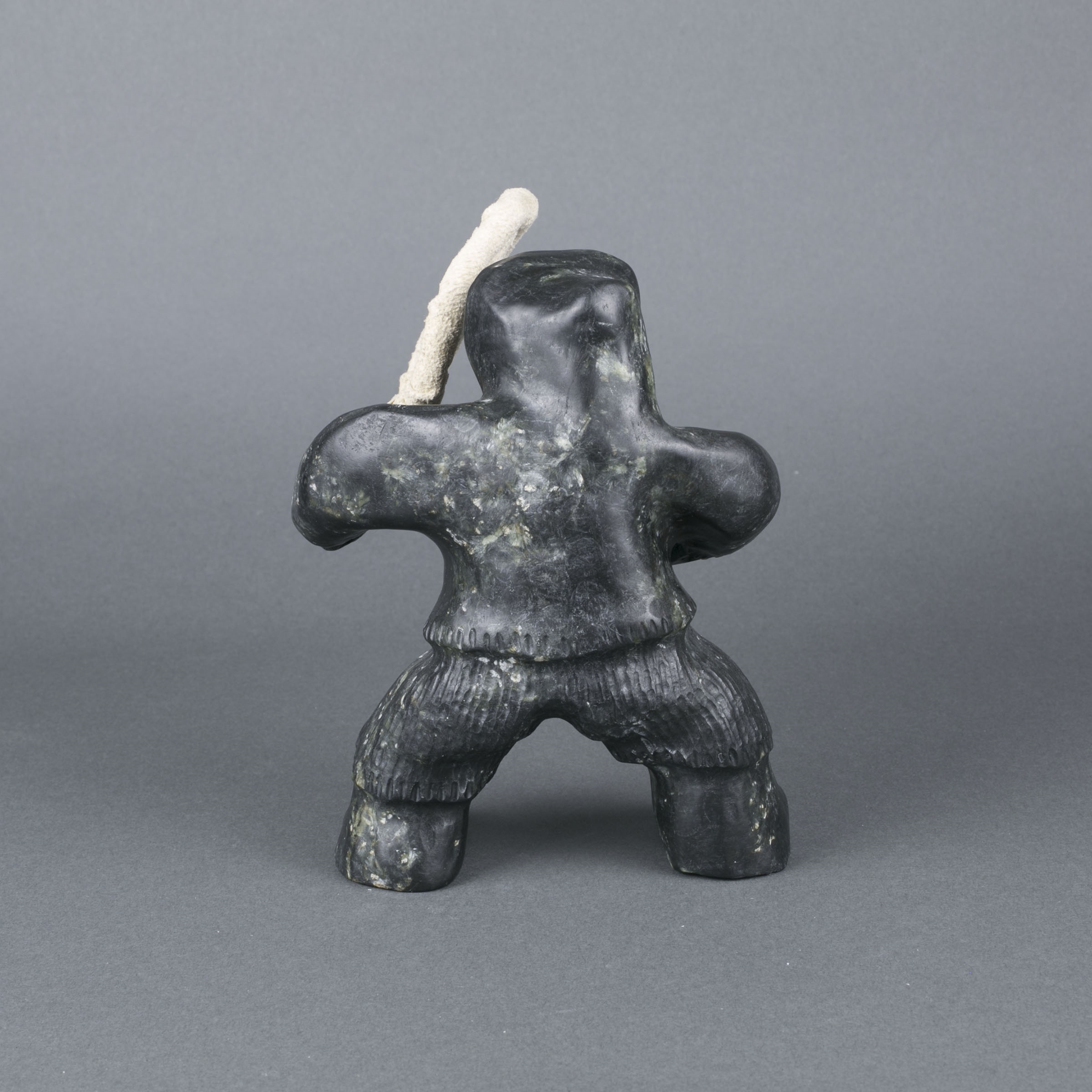 Artwork by Louis Mikkituq, DRUMMER, Made of bone, hide