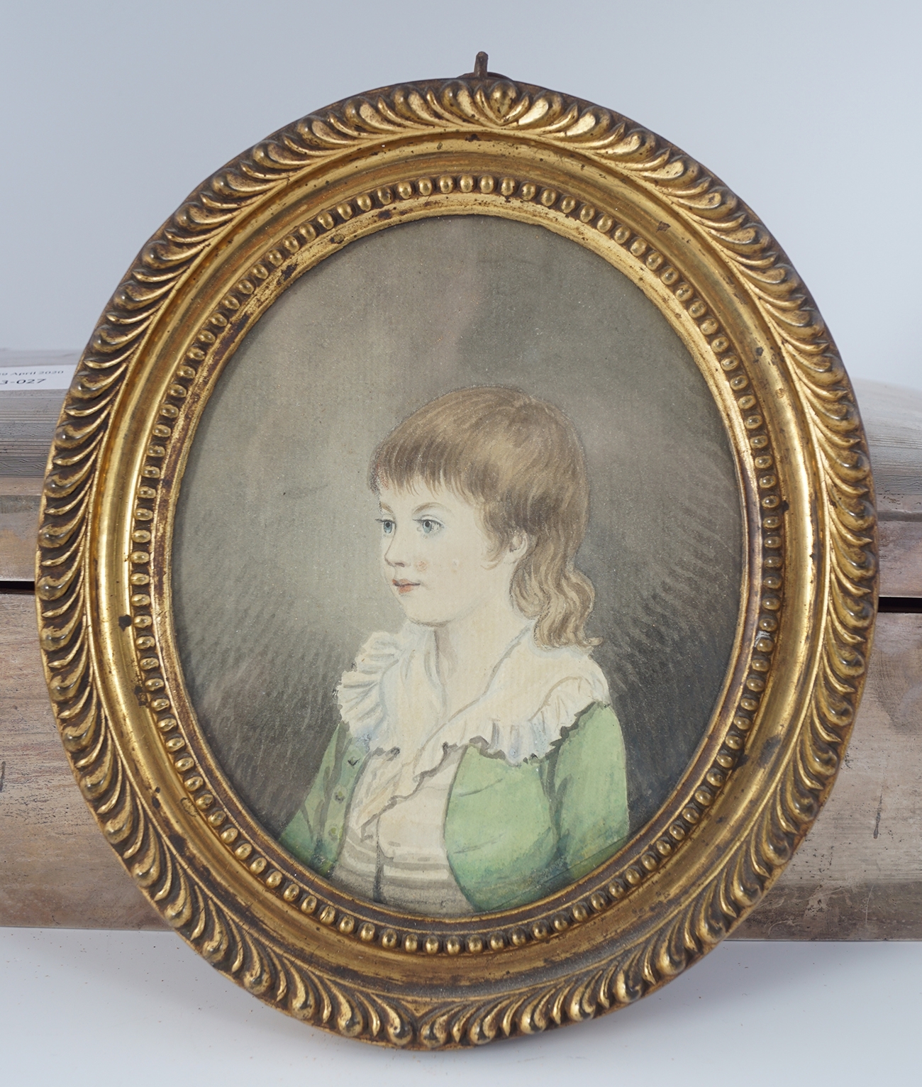 How does the narrator discover the oval portrait image