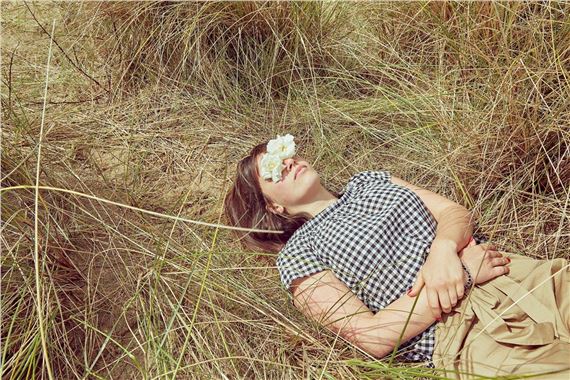 The girl lying in the fields with flower eyes by Chau-Cuong Lê