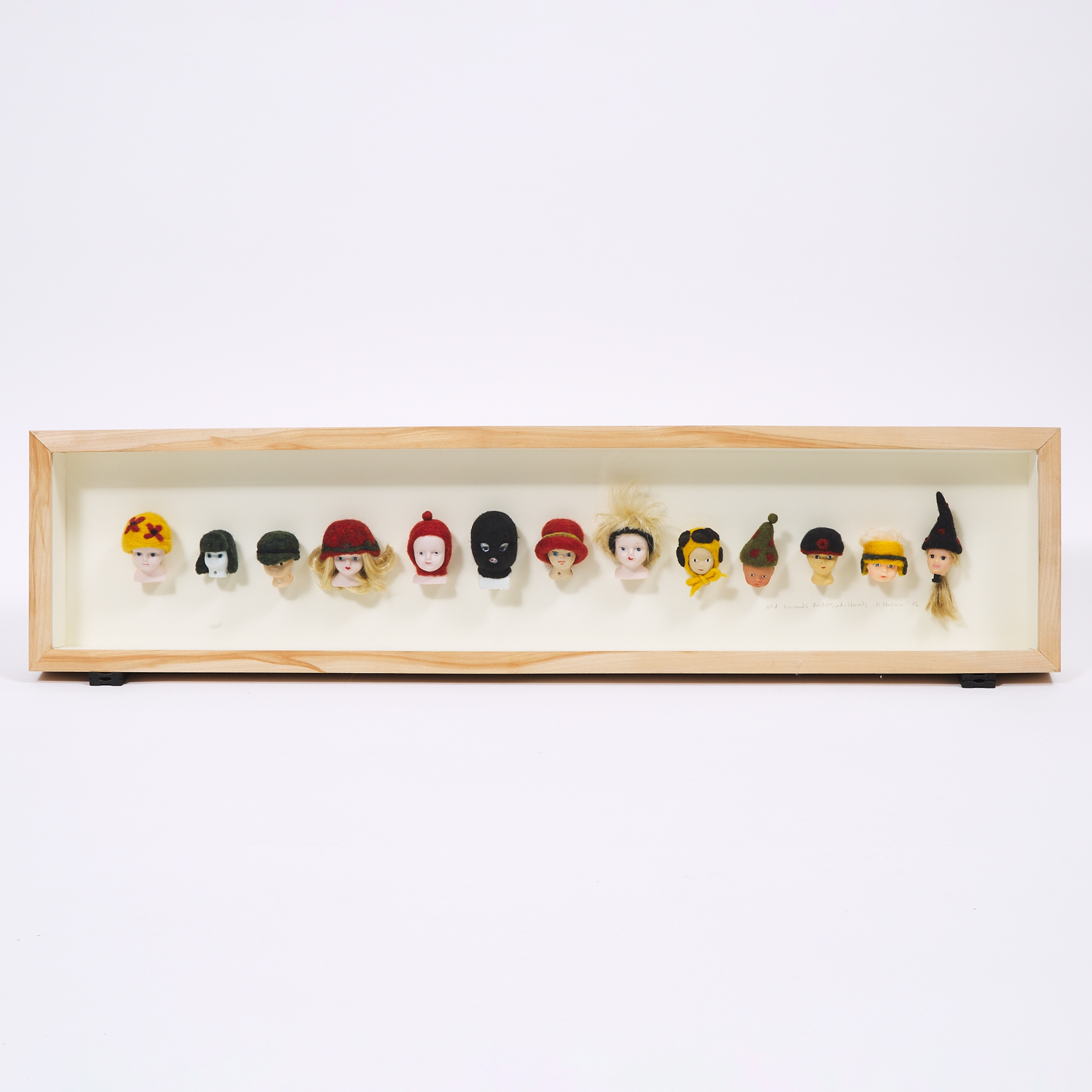 Artwork by M. Hogan, OLD FRIENDS REDRESSED - HEADS, Made of porcelain and plastic