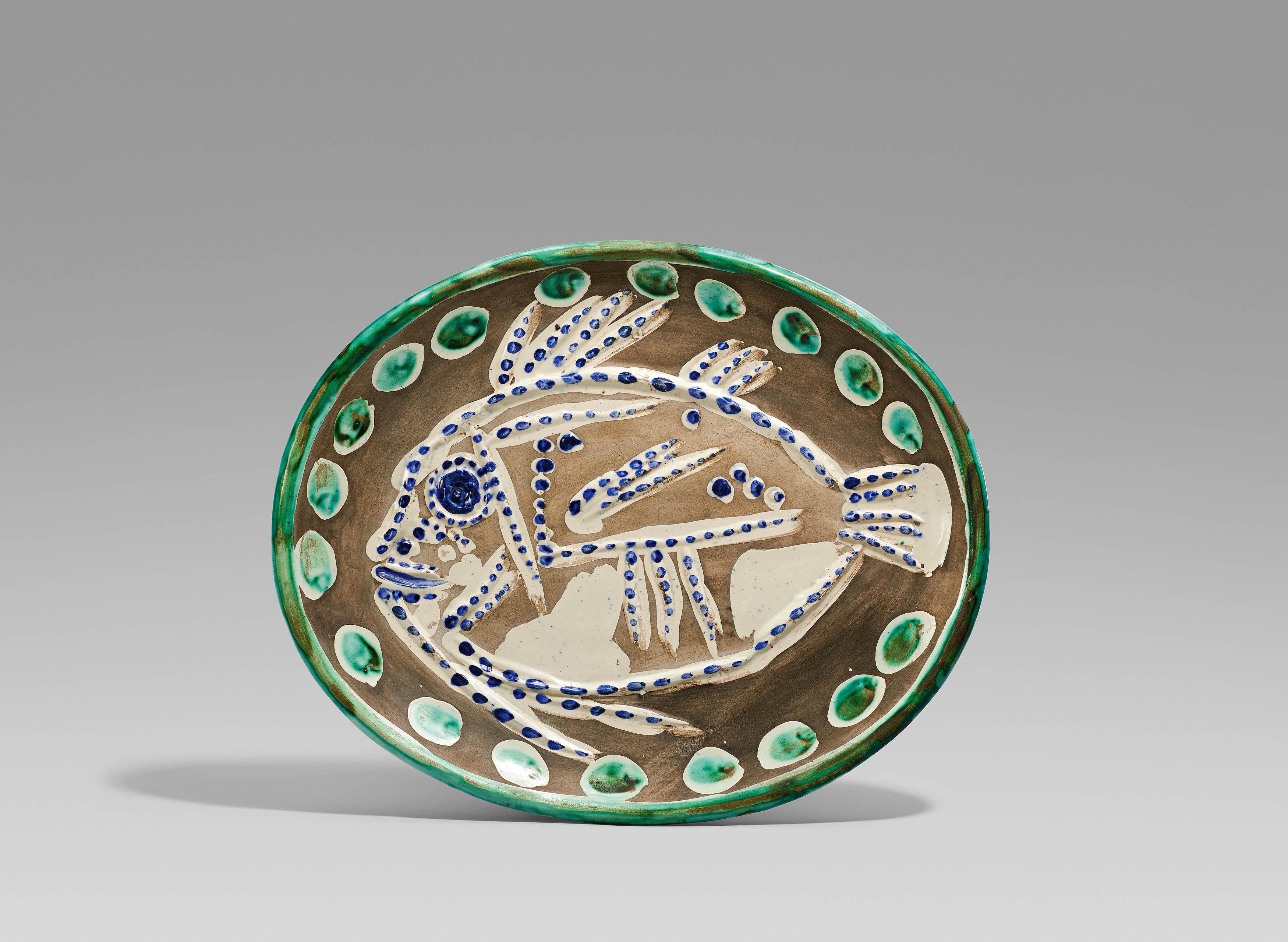 Artwork by Pablo Picasso, Black ground fish., Made of White earthenware, polychromed and partially glazed