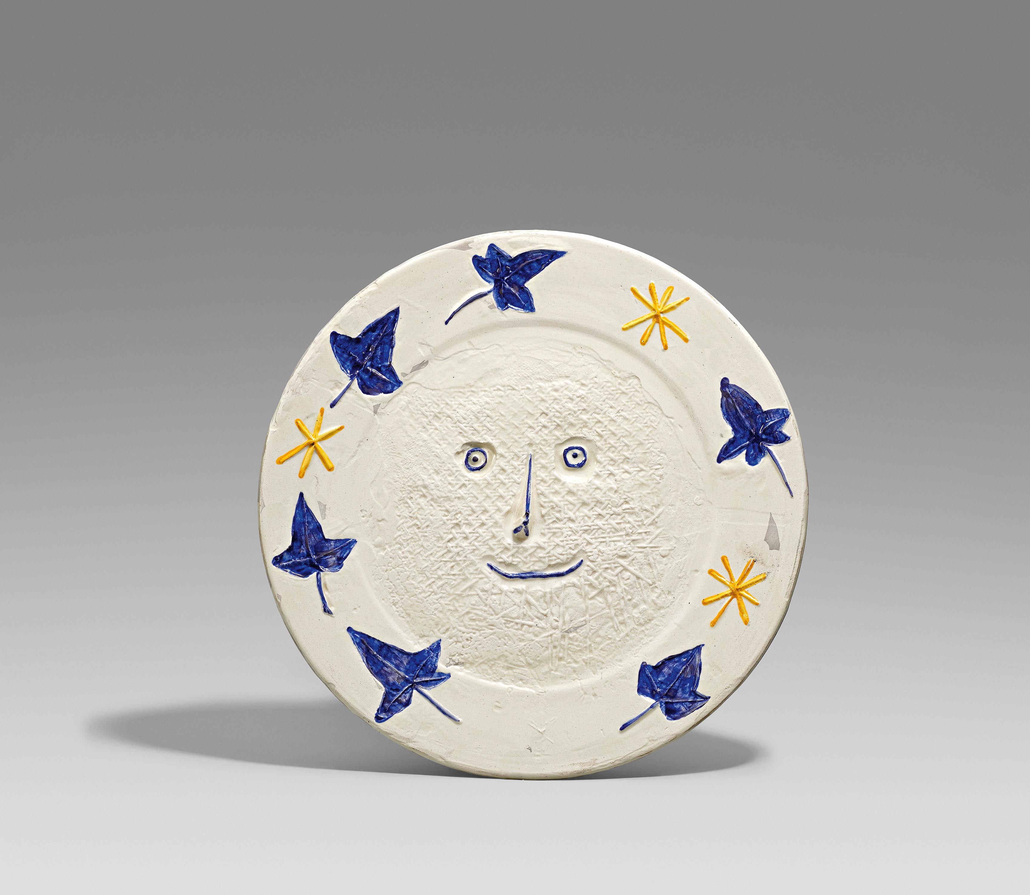 Artwork by Pablo Picasso, Face with leaves., Made of White earthenware, partially polychromed and glazed