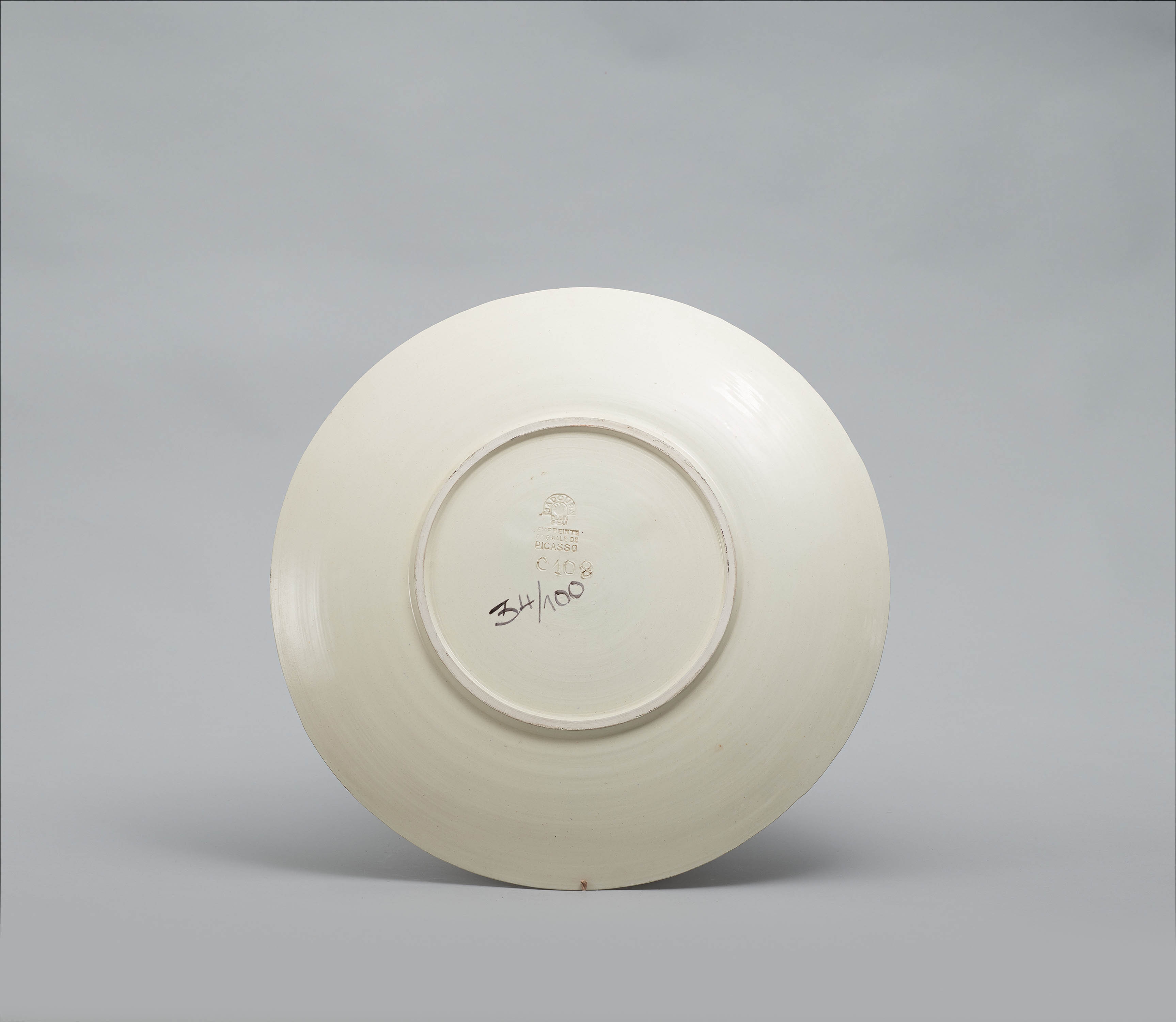 Artwork by Pablo Picasso, Face with leaves., Made of White earthenware, partially polychromed and glazed