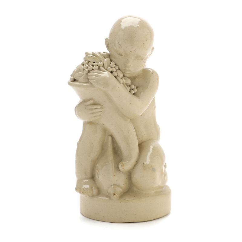 Artwork by Arno Malinowski, Stoneware figure group modelled in the shape of a cherub with dolphin and cornucopia, Made of Stoneware