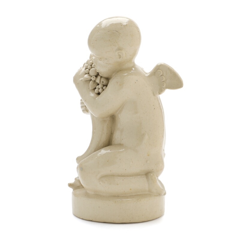 Artwork by Arno Malinowski, Stoneware figure group modelled in the shape of a cherub with dolphin and cornucopia, Made of Stoneware