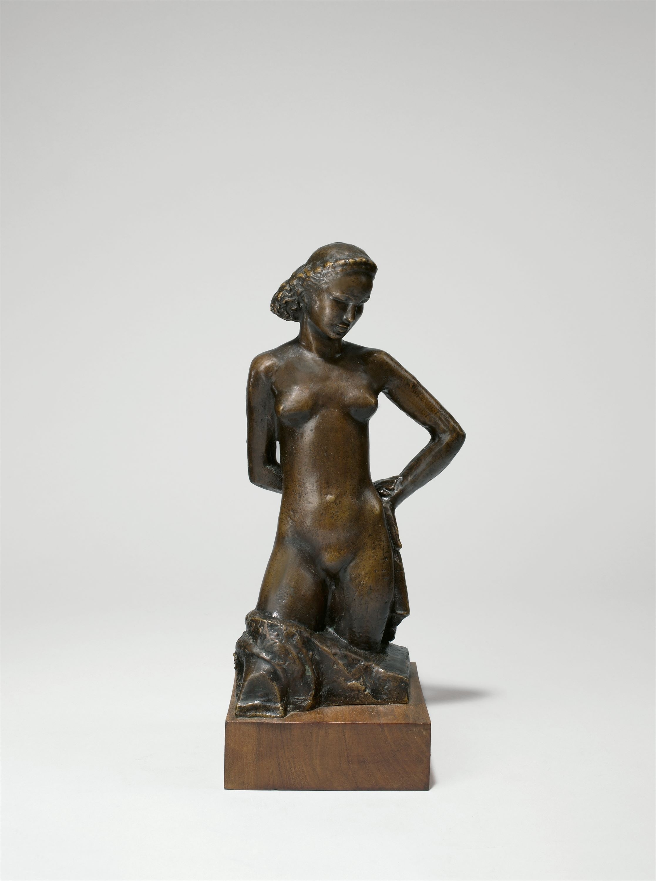 Artwork by Rudolf Edwin Belling, Girl (torso), Made of Bronze with dark brown patina, mounted on wooden base
