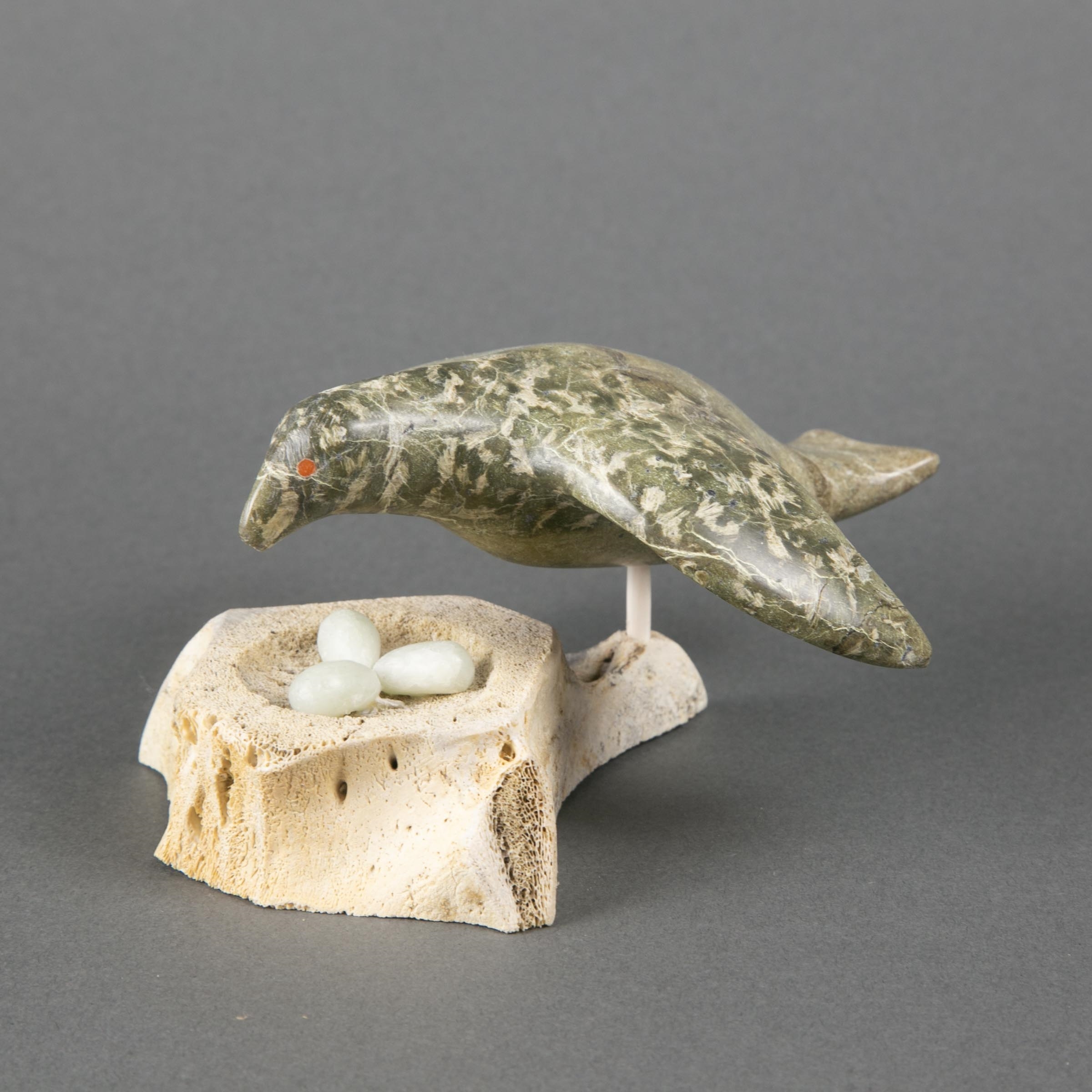 Artwork by Simeonie Amagoalik, BIRD PROTECTING HER EGGS, Made of bone, stone
