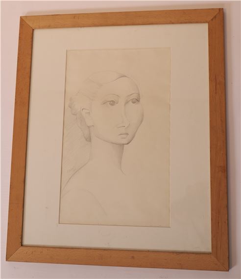 A framed charcoal sketch of a stylized female face with elongated features and a neutral expression.