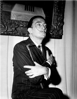 Salvador Dali posing in front of his painting "Cruz Nuclear" during his exhibition at the Palezzo Pallavicini Rospigliosi in Rome - Ezio Vitale