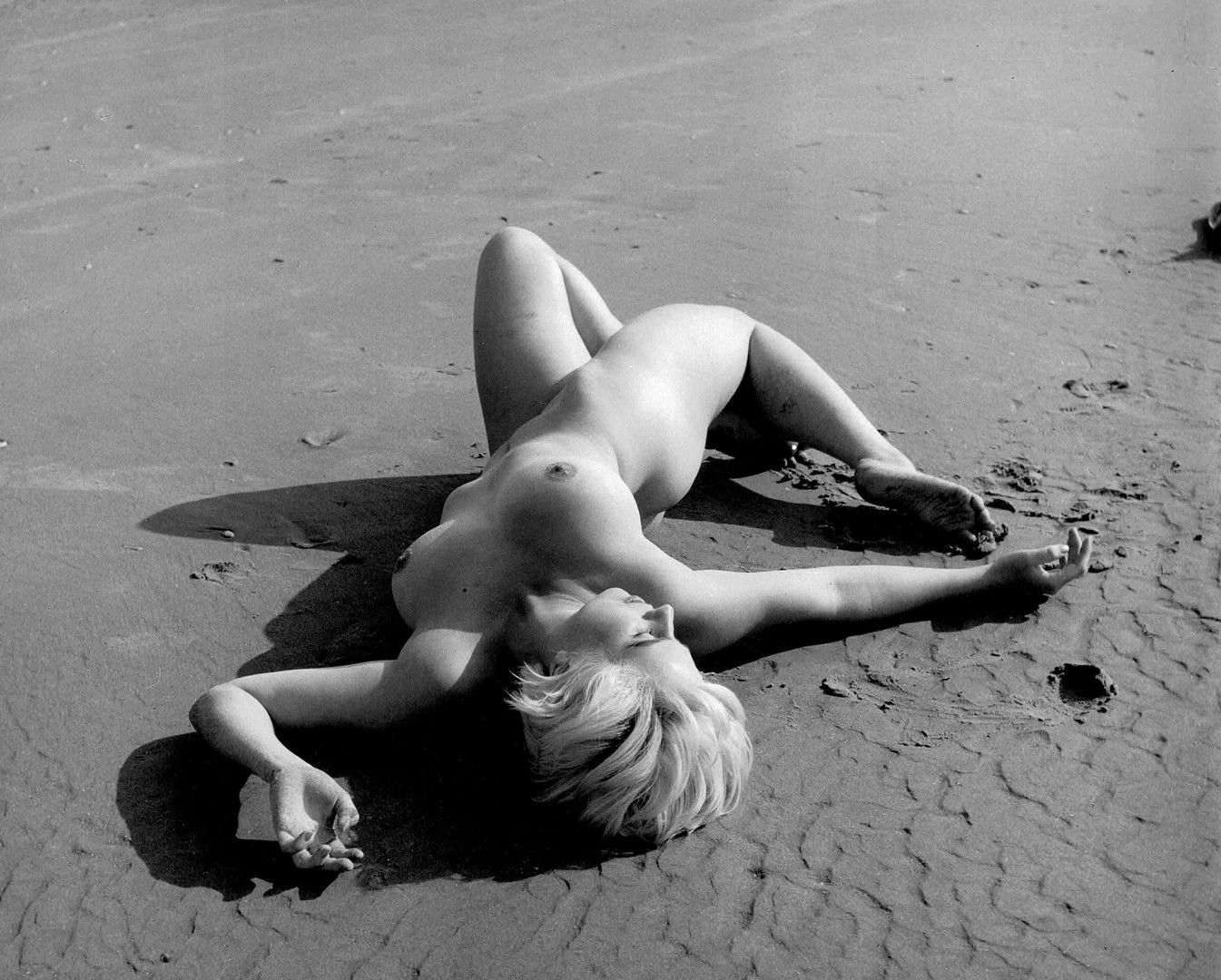 Artwork by Russell Gay, Naturism, woman on the beach, ball game, on the rocks, Made of silver prints