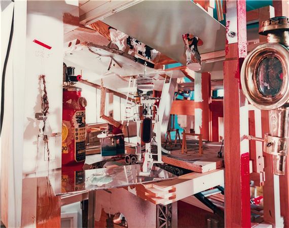 A chaotic, multi-layered interior scene filled with industrial and domestic objects.