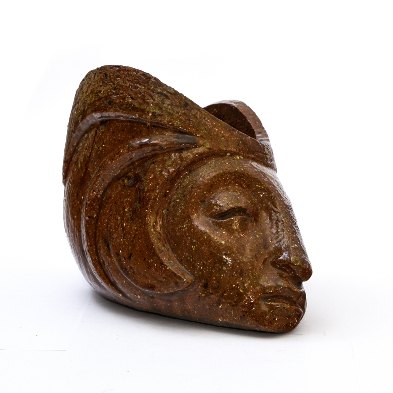 Artwork by Francisco Durrio, Sleeping head vase, Made of Shiny brown-ochre enamelled ceramic