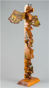 a carved and polychromed totem pole - Patrick H. Earl