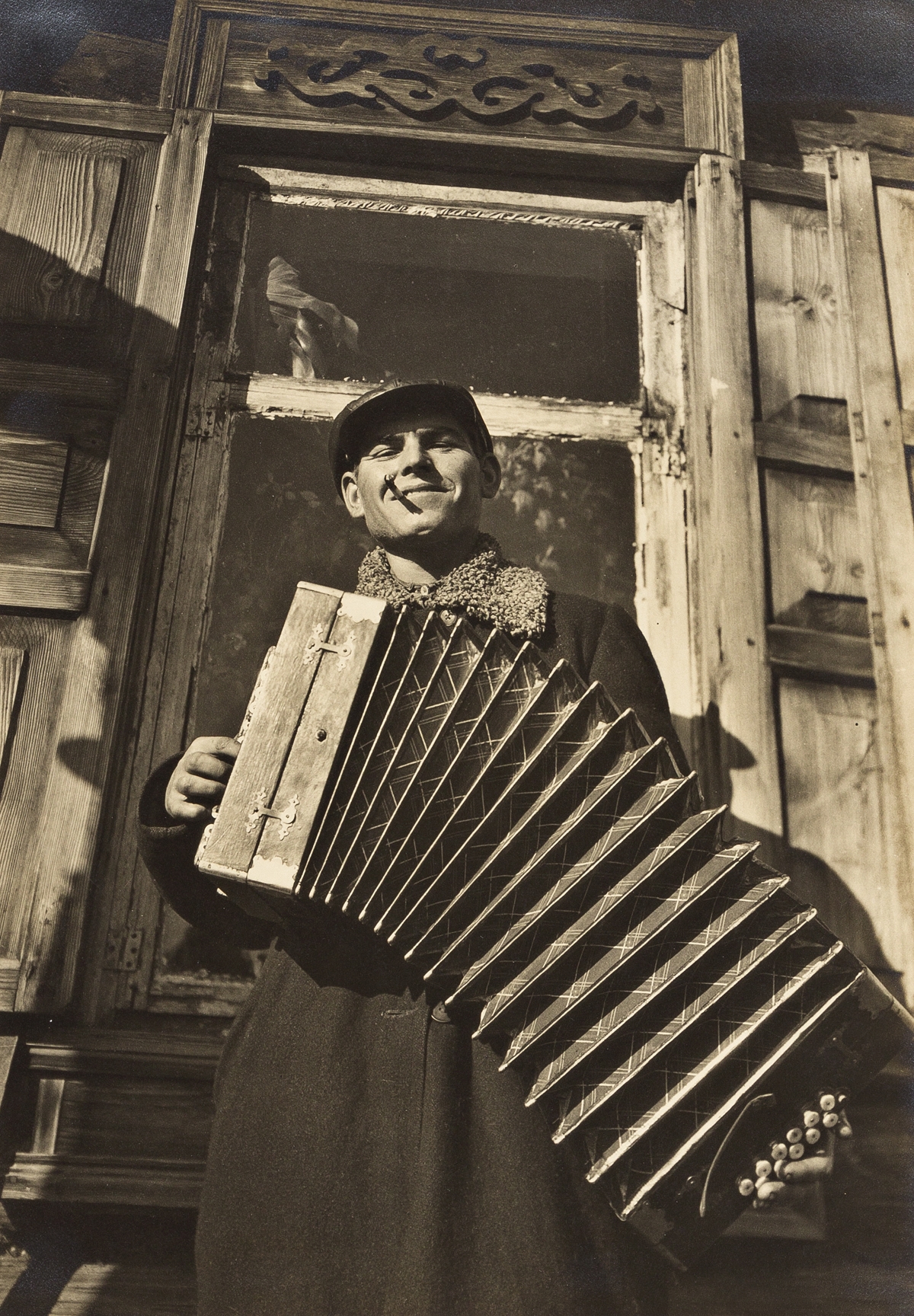 Artwork by Margaret Bourke-White, Soviet Serenade (Accordion Player)., Made of toned silver print