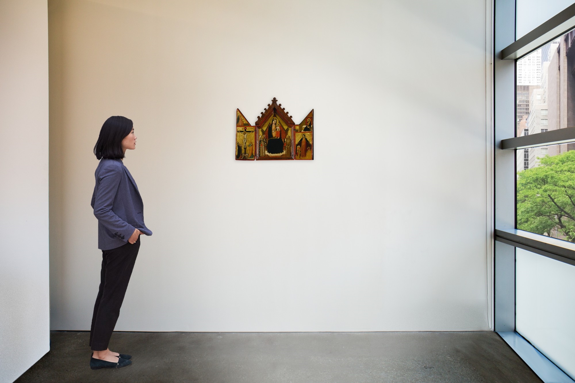 Artwork by The Mezzana Master, The Madonna and Child enthroned between Saints Louis of Toulouse and Francis (central panel); Crucifixion below the Angel of the Annunciation (left shutter); Madonna della Misericordia below the Virgin Annunciate (right shutter): a triptych, Made of oil on gold ground panel