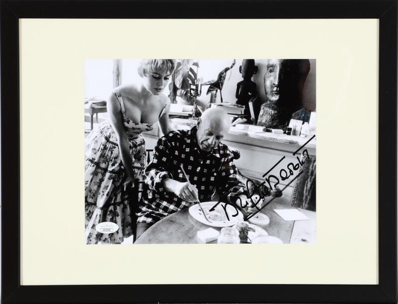 Artwork by Jérôme Brierre, A signed b/w press photograph of the French actress Brigitte Bardot (b. 1934) in the company of the painter Pablo Picasso in his studio, Made of photograph