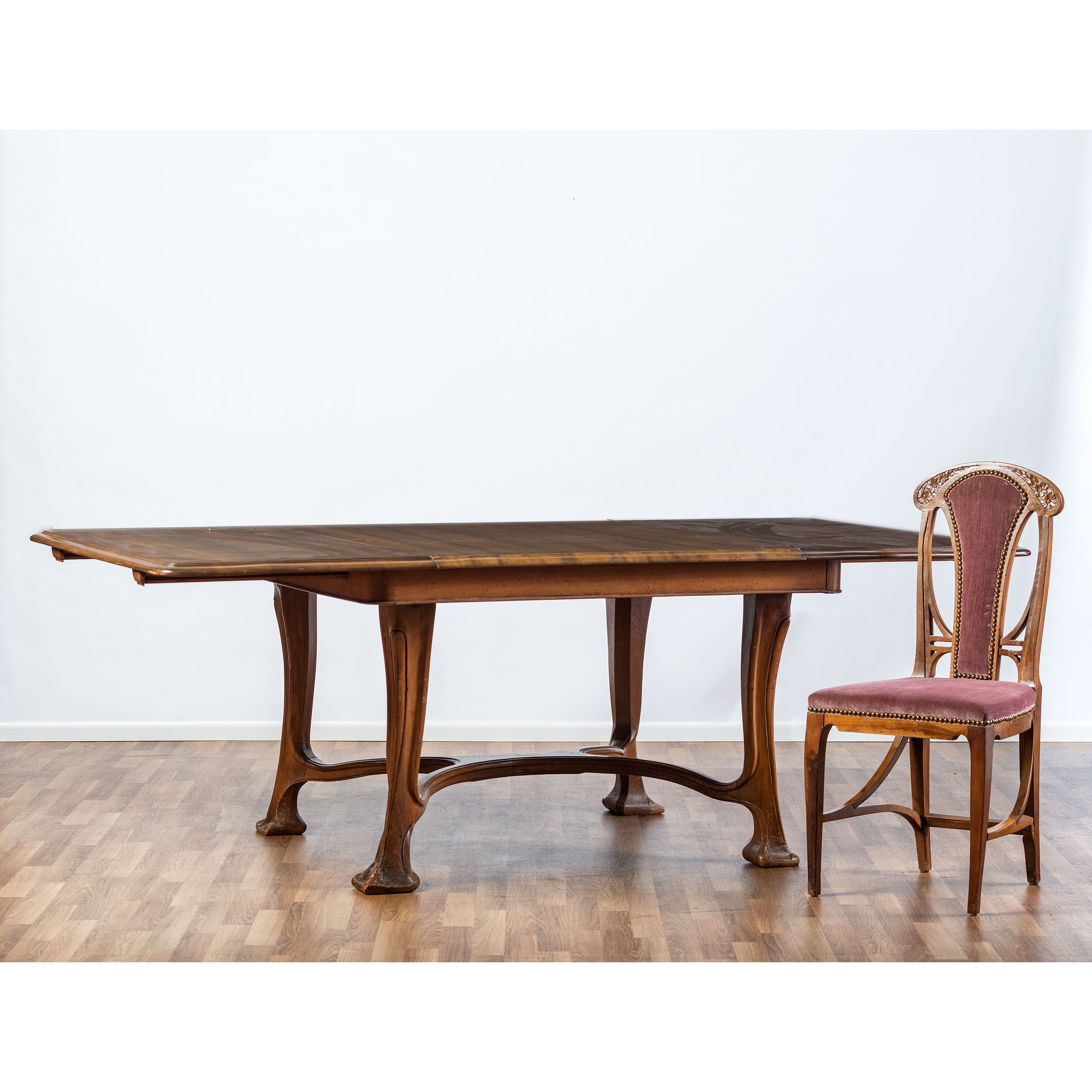 Louis Majorelle An Art Nouveau Dining Table and Six Chairs, in the