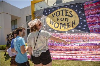 Monumental Flag Installation Outside the Women's Museum Celebrates Voting Rights
