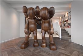 Reflex Amsterdam Opens New Space with a Sculpture by KAWS
