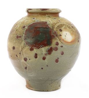 two stoneware jars of baluster form one in a burgundy glaze one in a mottled yellow glaze each decorated with glazed and incised circles - Adam Frew