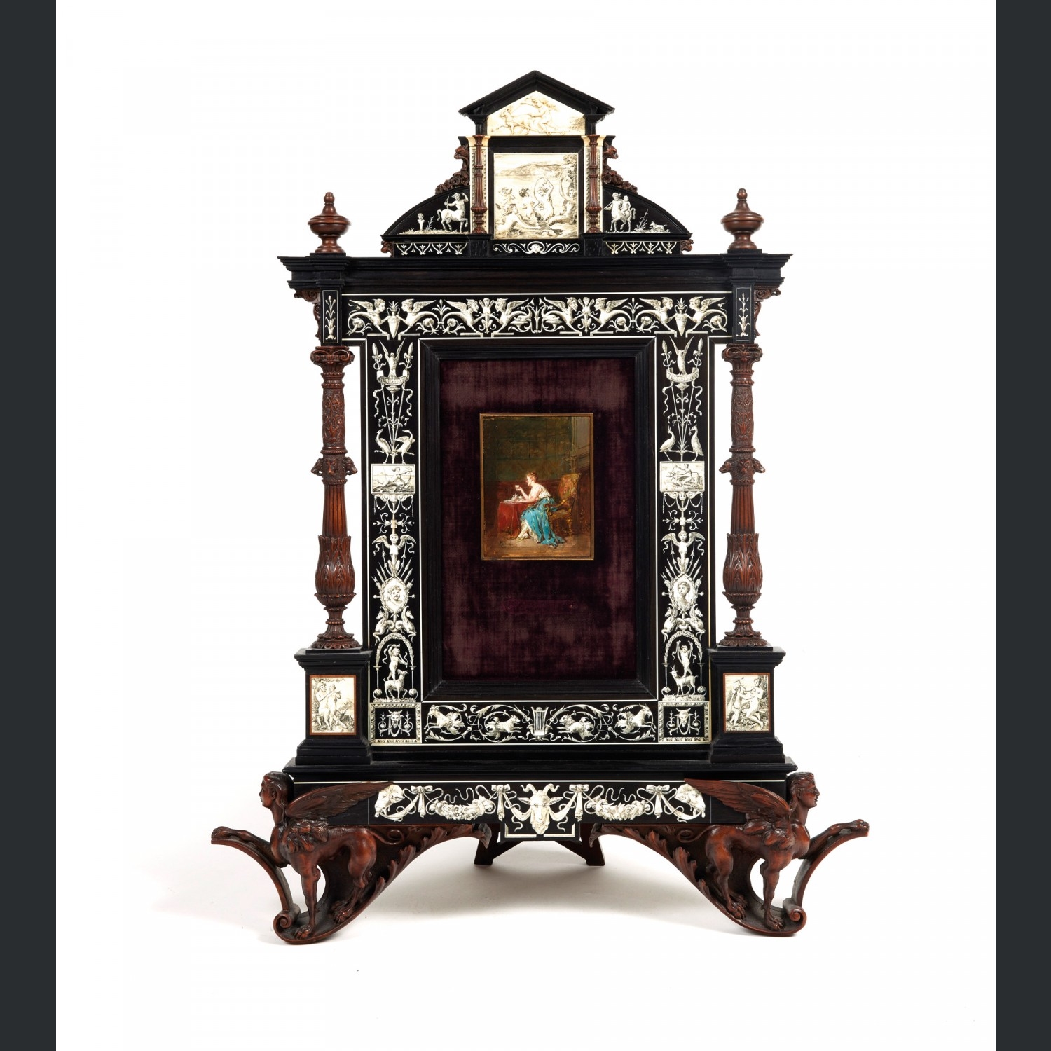 Artwork by Antoine Emile Plassan, P. Grandi, A. Guidi, Cadre de table simulant façade; femme prenant son thé, Made of molded and carved walnut and ebony and ivory marquetry, resting on a sphinx base; oil on panel