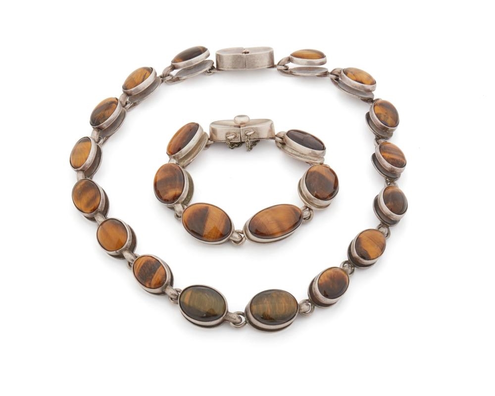A assembled set of sterling silver and tiger's eye jewelry by Antonio Pineda