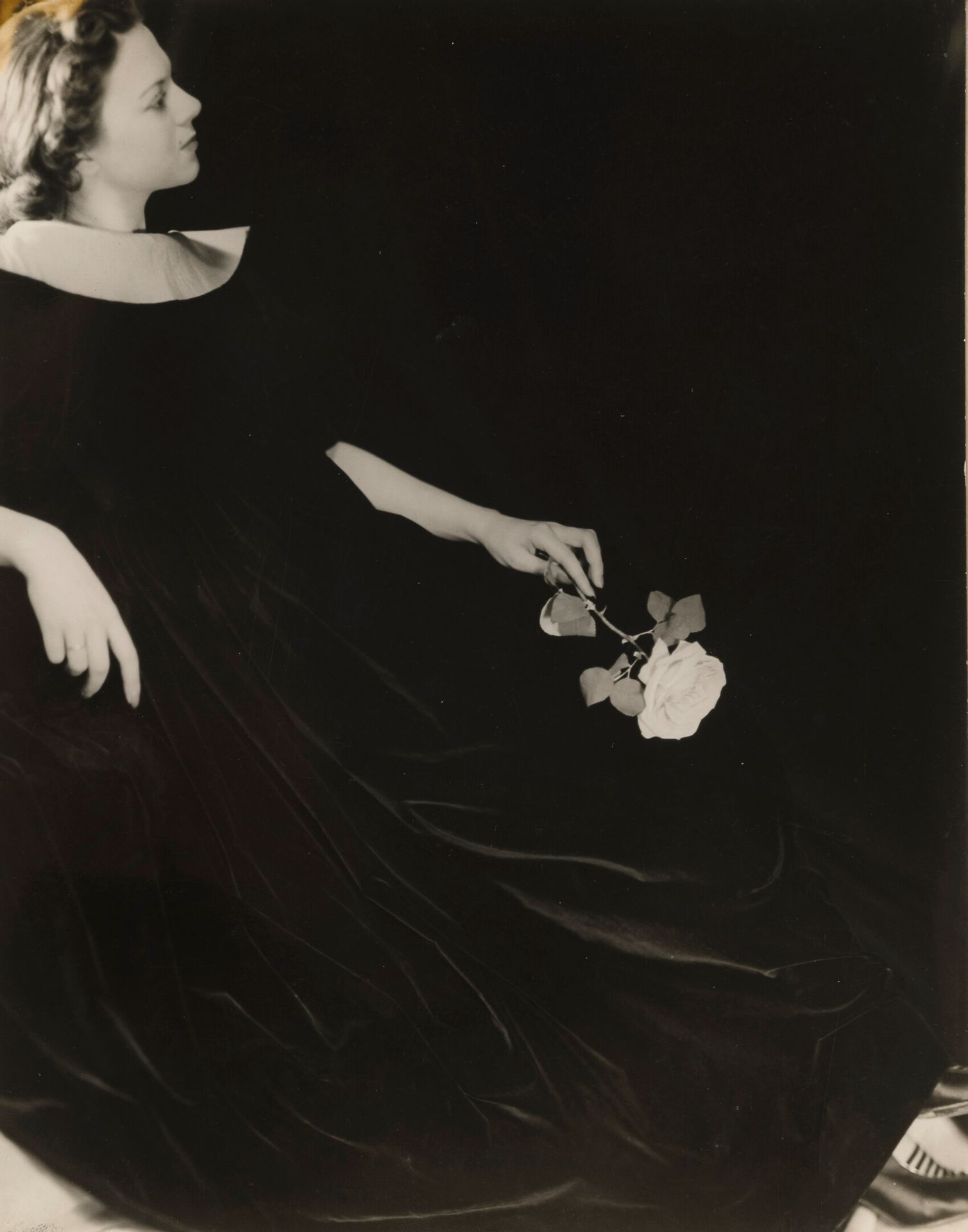 Lady in black with a rose by Laure Albin-Guillot, circa 1930-1940