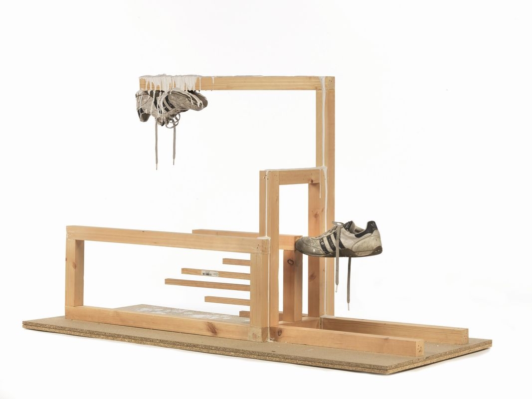 Artwork by Alexandre Singh, The marque of the third stripe IV, Made of wood, plaster, shoe of the artist