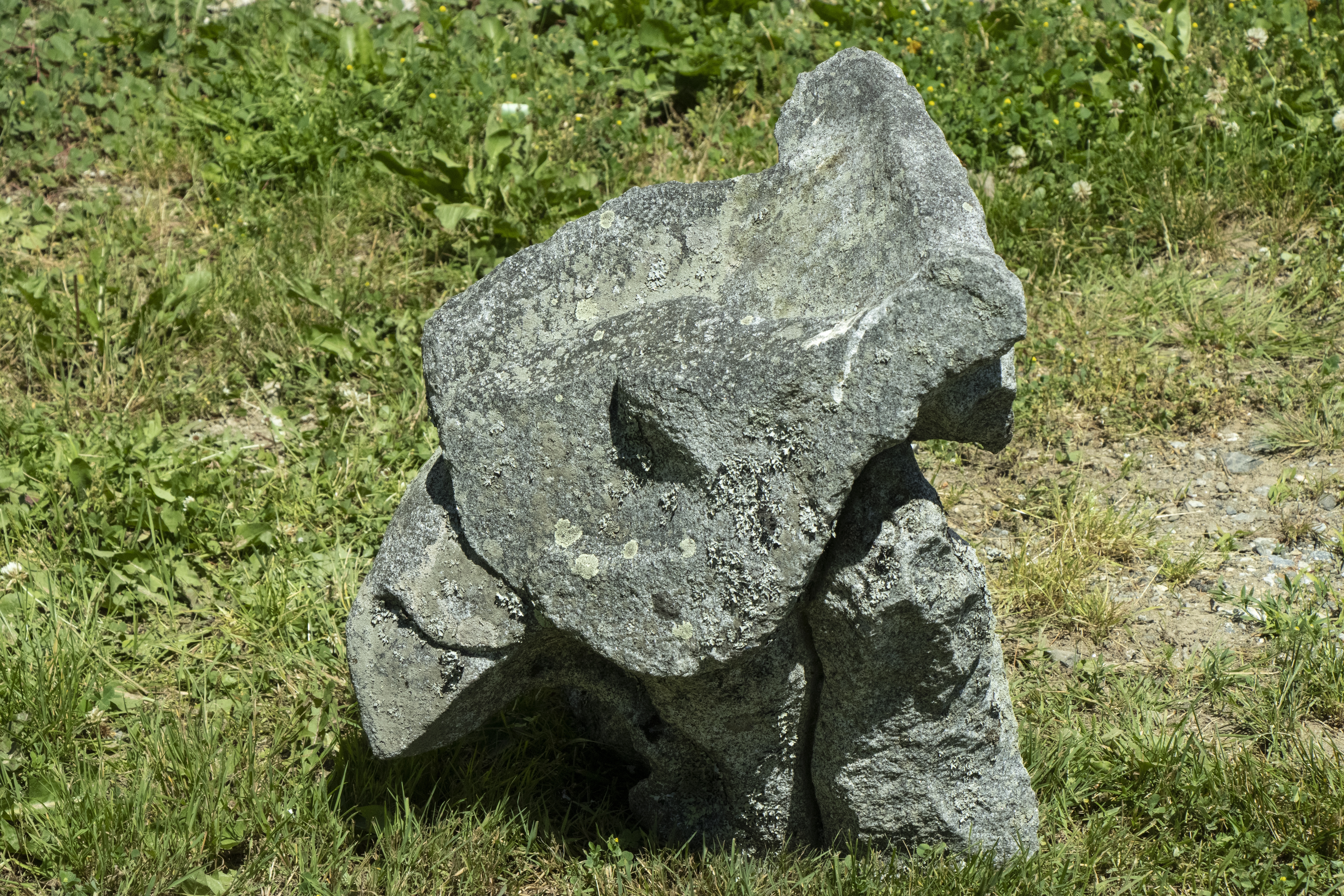 Artwork by Don Meserve, Standing Raven, Made of granite sculpture