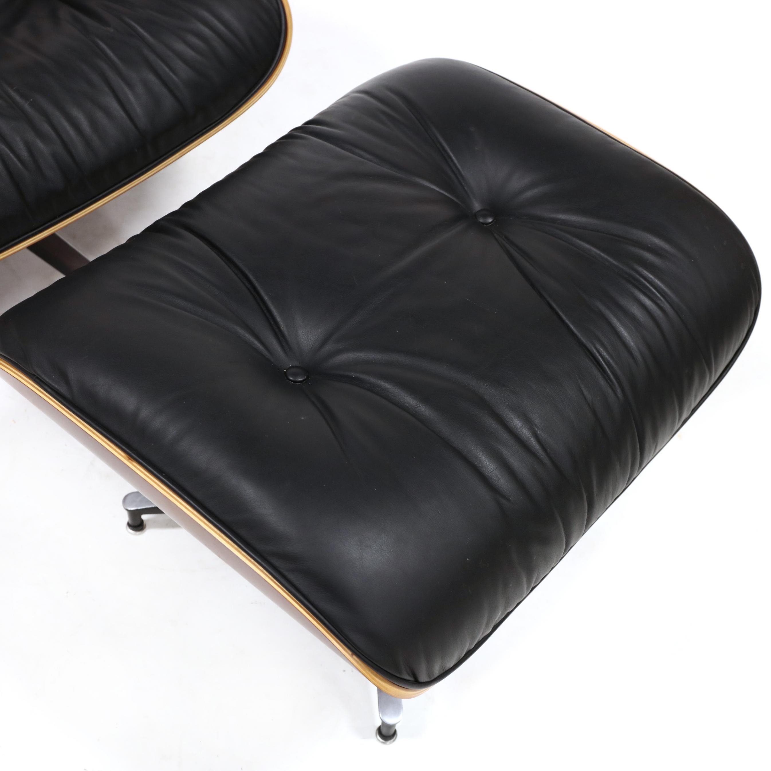Artwork by Herman Miller, 670 Lounge Chair and 671 Ottoman, Made of cherry laminated