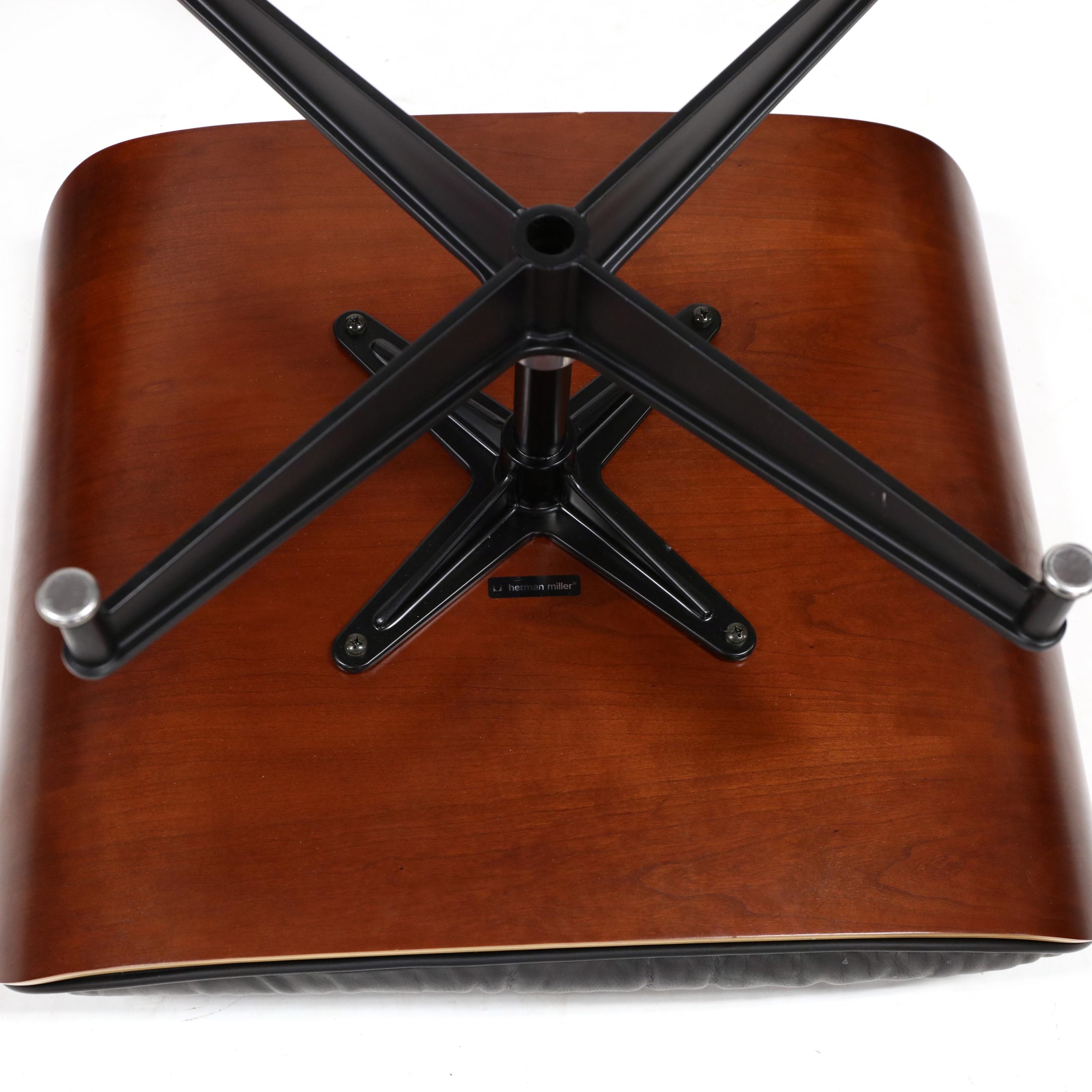 Artwork by Herman Miller, 670 Lounge Chair and 671 Ottoman, Made of cherry laminated