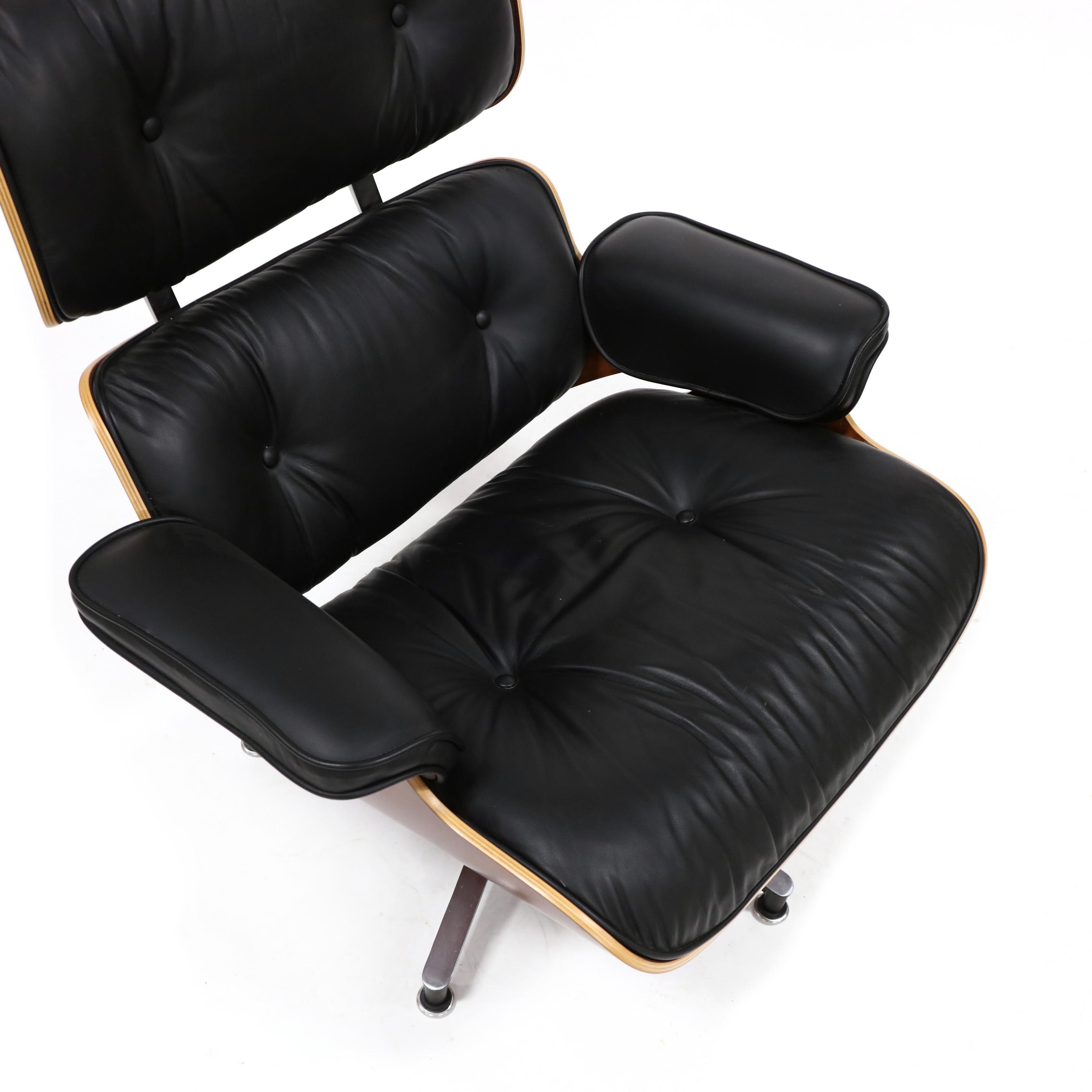 Artwork by Herman Miller, 670 Lounge Chair and 671 Ottoman, Made of cherry laminated