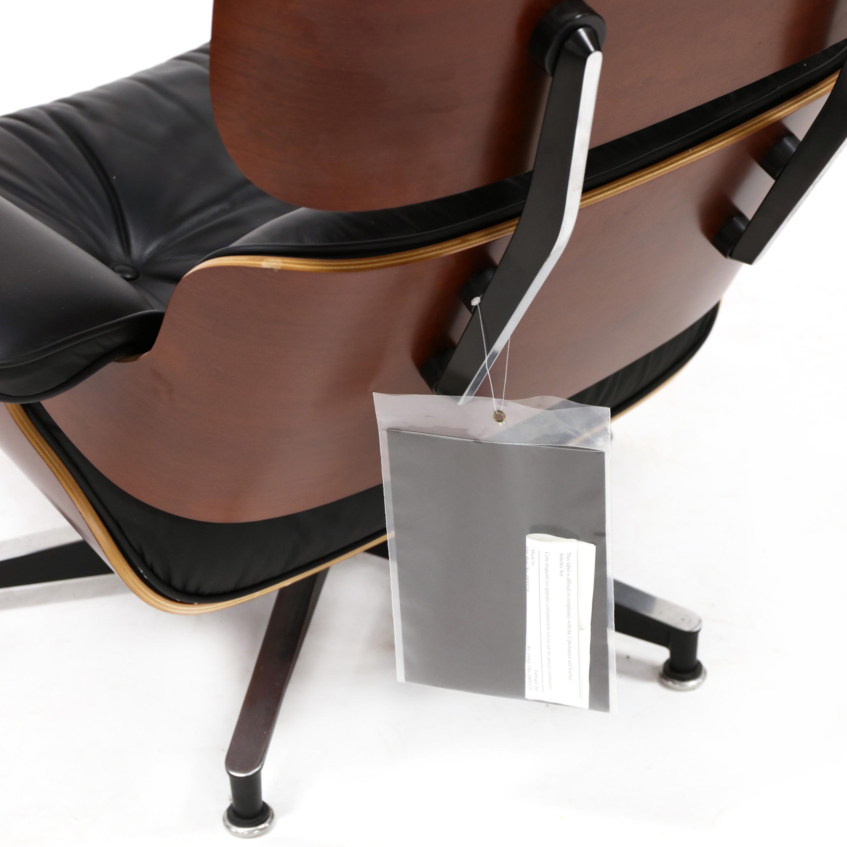 Artwork by Herman Miller, 670 Lounge Chair and 671 Ottoman, Made of cherry laminated