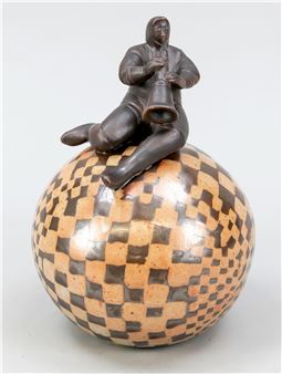 Female figure with wind instrument sitting on a checkered ball - Monique Degluaire