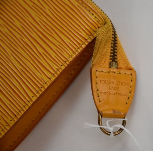 Lot - A yellow epi leather shoulder bag and belt, Louis Vuitton
