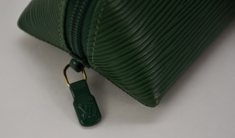 Louis Vuitton, Three Louis Vuitton Epi Leather articles including a yellow  cosmetics pouch, a green pencil case and a green key holder