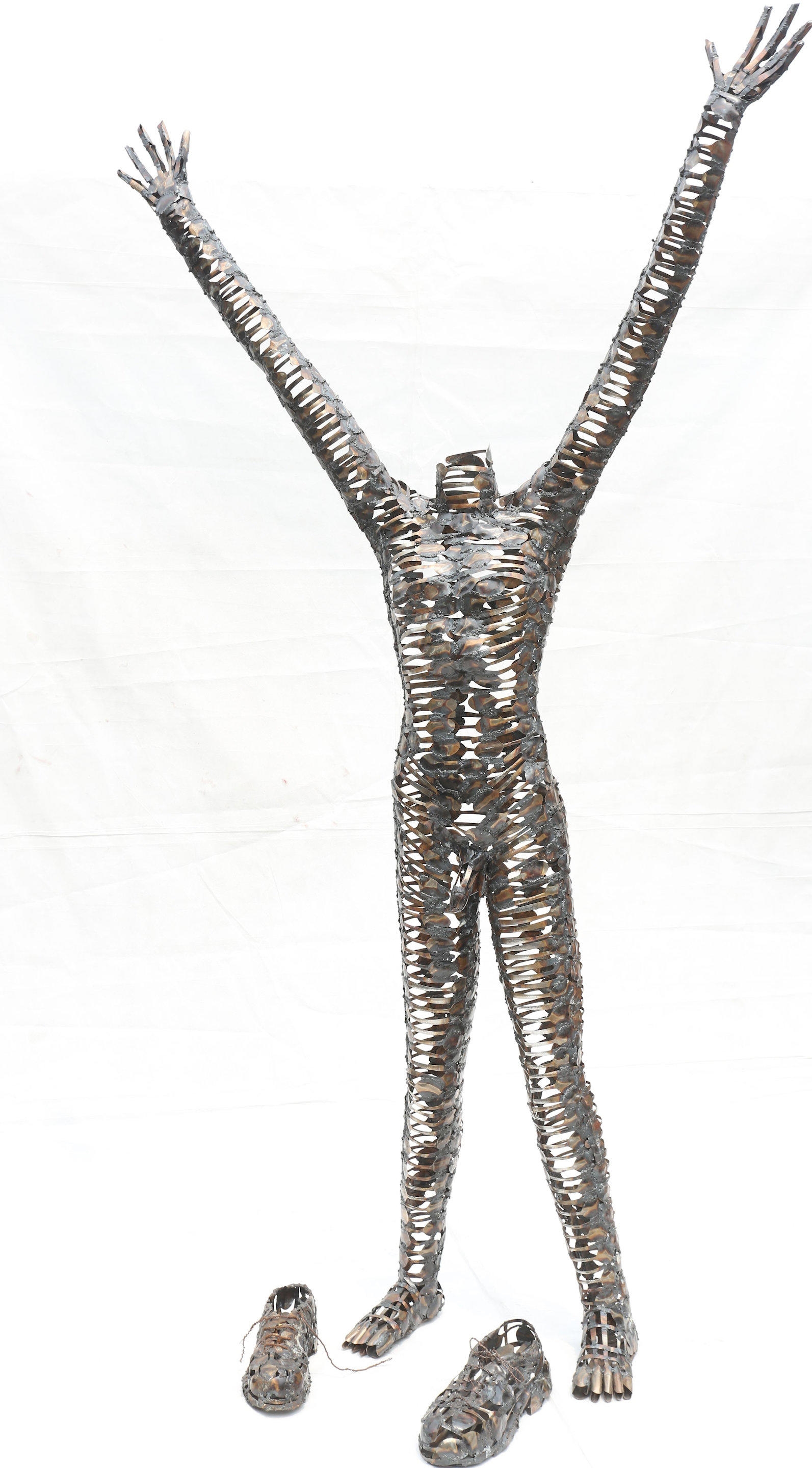 Artwork by Freddy Tsimba, Centre fermé, rêve ouvert, Made of welded spoons and recovered metal