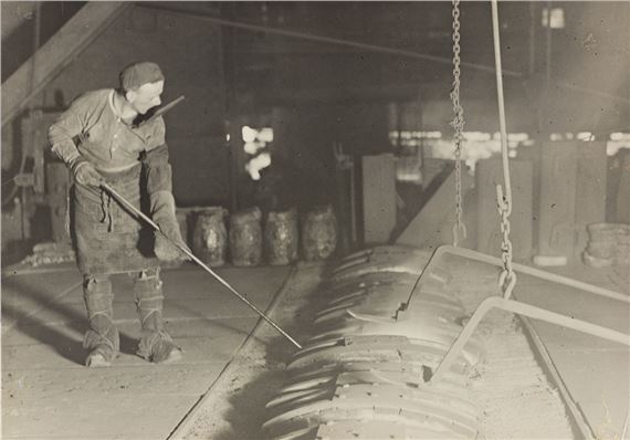 Steel worker at open-hearth furnace. by Lewis Hine, 1908