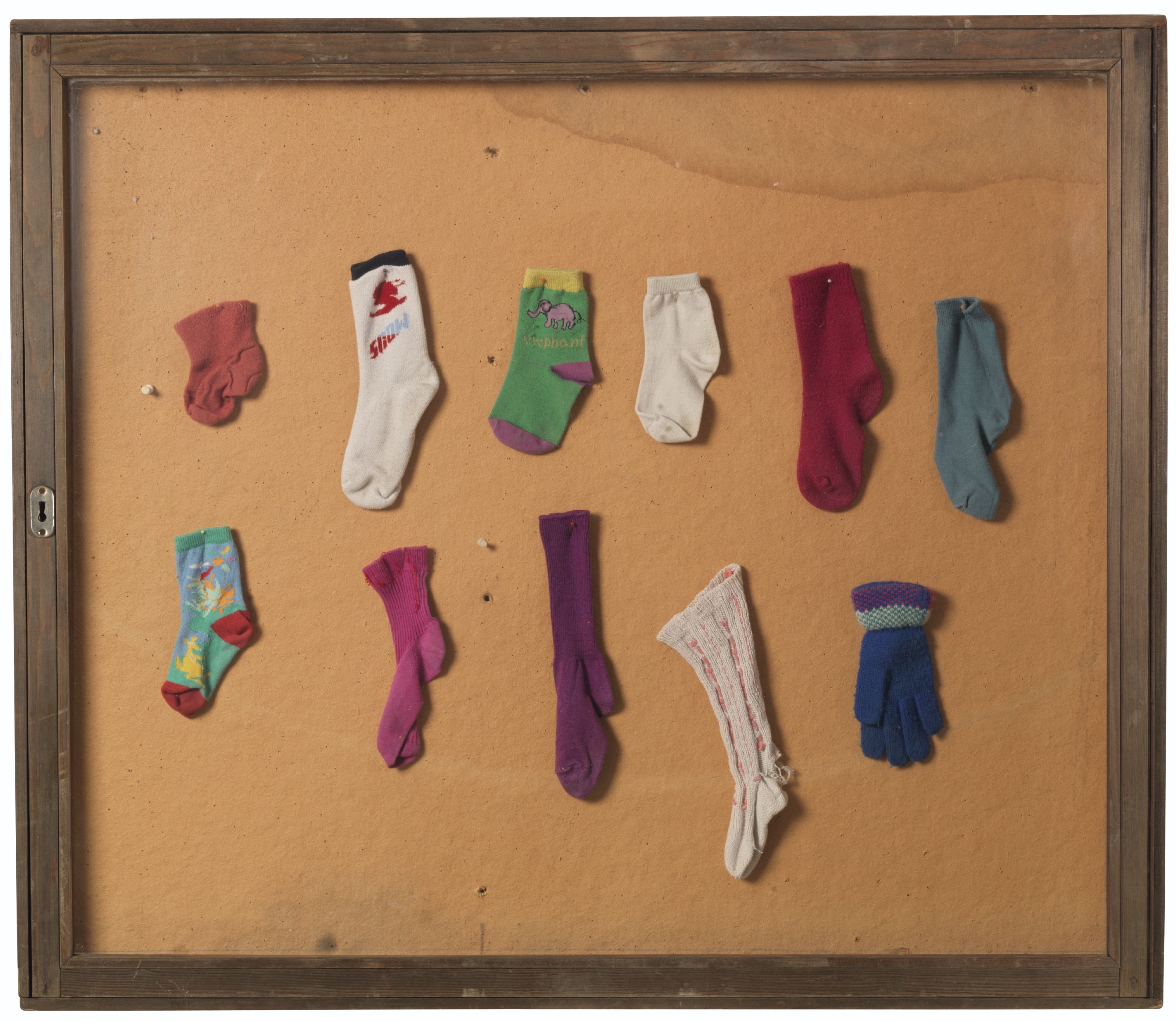 Artwork by Suchan Kinoshita, (i) Egg Timer Sculpture(ii) Singles, Made of (i) glass vessels filled with various liquids, in eight parts  (ii) found socks and glove in glass vitrine and wood