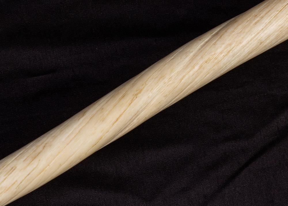 Artwork by Adla Korgak, Allan Sheutiapik, A narwhal tusk supported on a pair of polar bears, Made of carved of Iqaluit