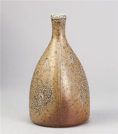 a salt glazed bottle with incised decoration by John Jelfs