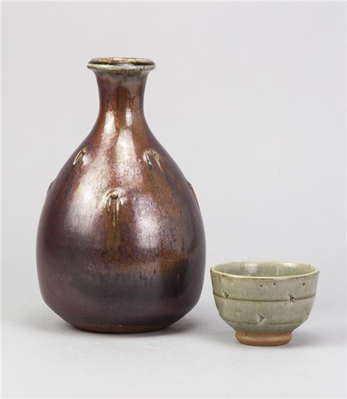 a stoneware bottle covered in iron rich glaze by John Jelfs