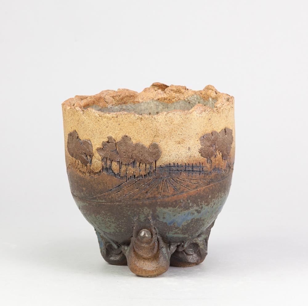 Artwork by Peter Gooderham, a deep stoneware bowl on tripod feet with applied and incised landscape decoration, Made of stoneware