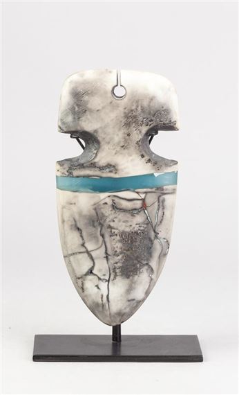 a pierced raku shield or arrowhead form suspended on a metal strand by Peter Hayes, dated 2003
