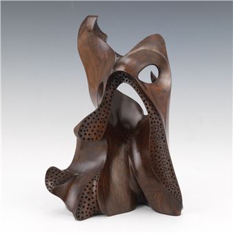 Abstract carved wood sculpture with perforations - Ray Muniak