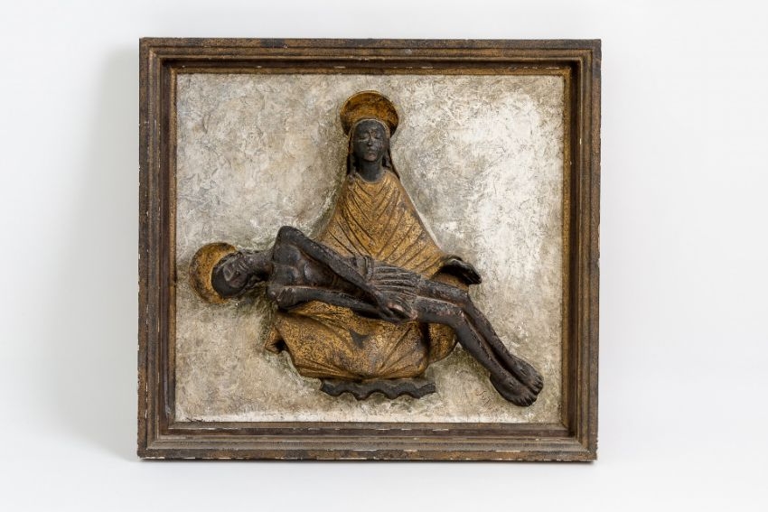 Artwork by Emil Sutor, Pieta, Made of Wooden sculpture. Half-round carved and shaped, partially set in gold and mounted on a rectangular, white-framed wooden plate