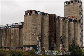Old dormant grain silos on South Side are an enduring industrial canvas for graffiti artists