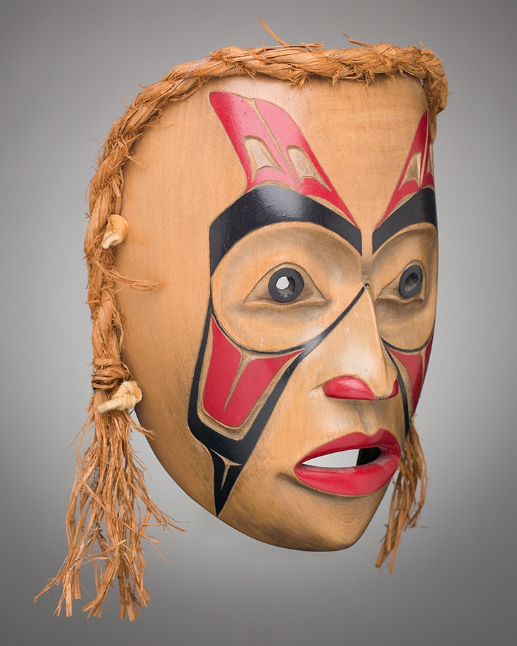 Artwork by D. Helifton, Mask, Made of carved cedar, bark, acrylic